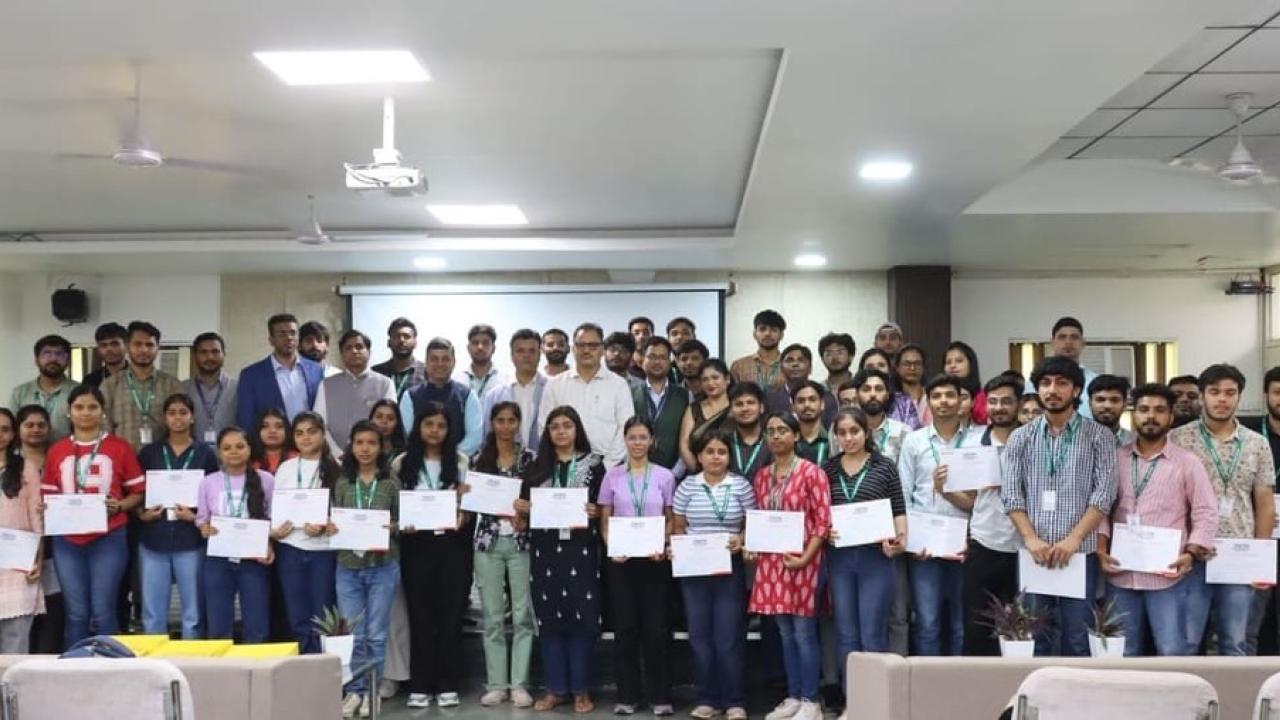 students holding up their certificates