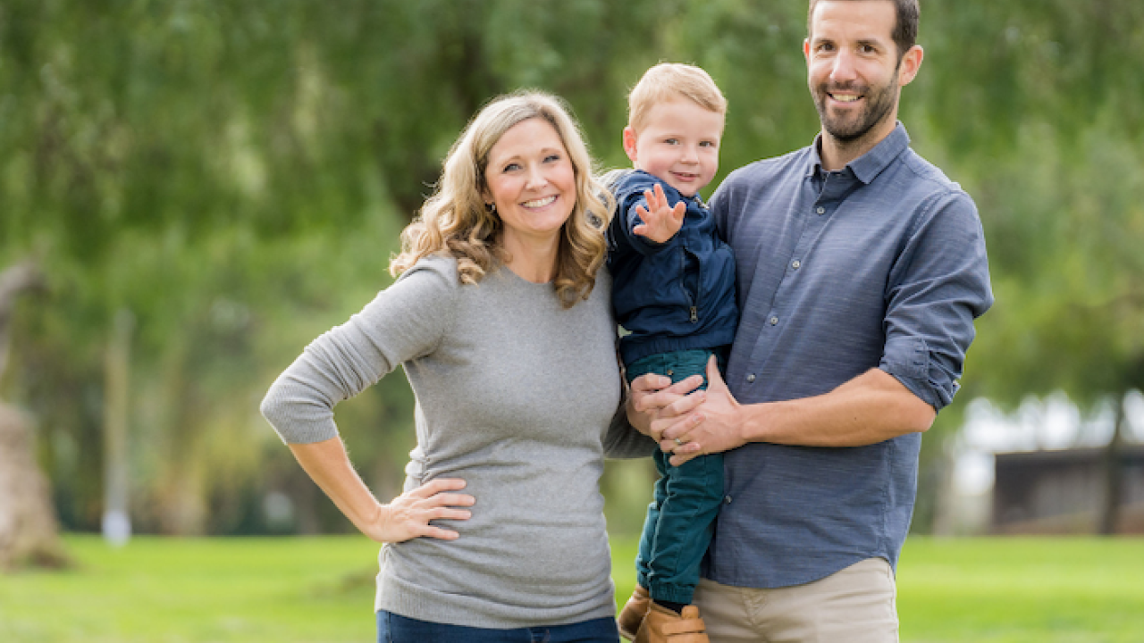 Christina and Daniel Kettler holding baby Fitz.