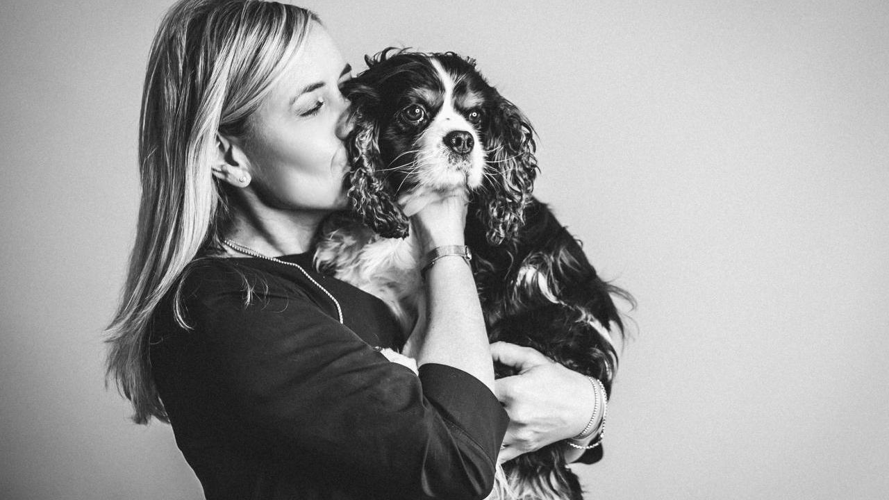 Jutta and pet dog embracing cuddle