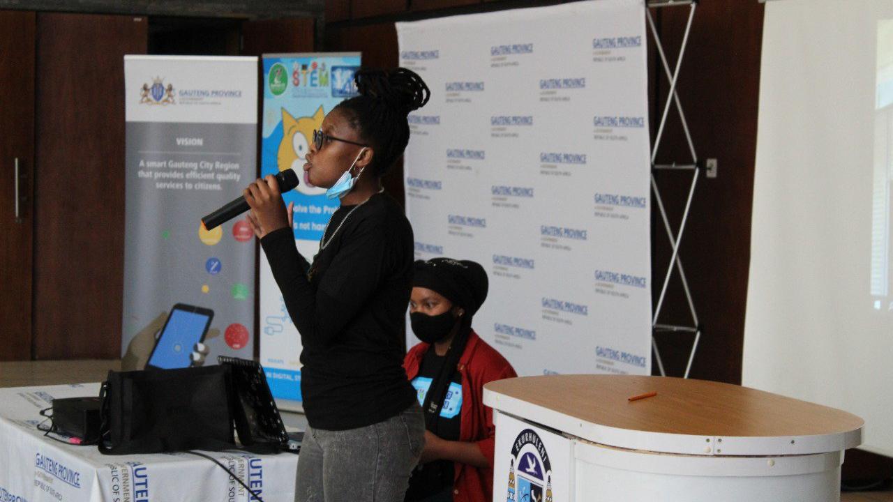 person speaking into a microphone