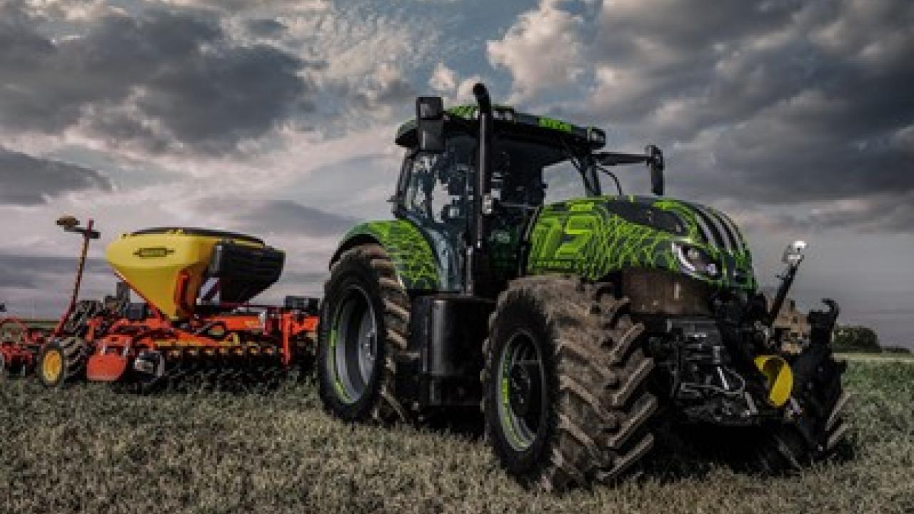 Green tractor in a field