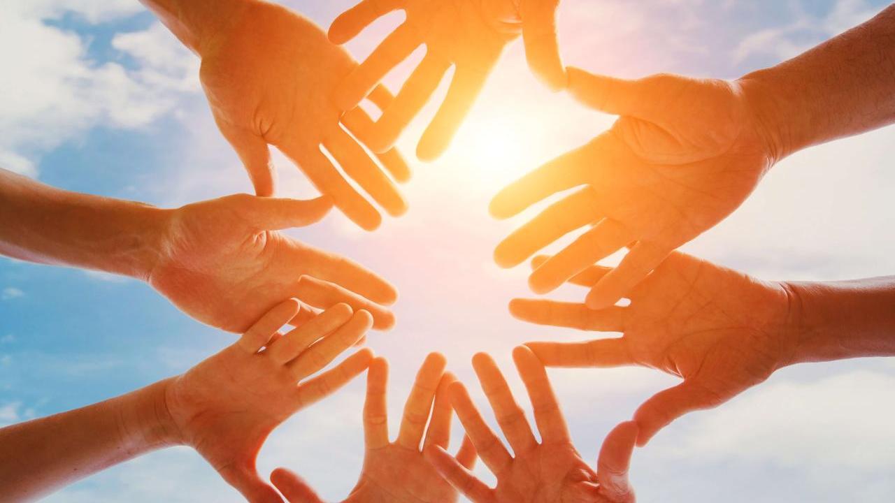 People putting their hands together