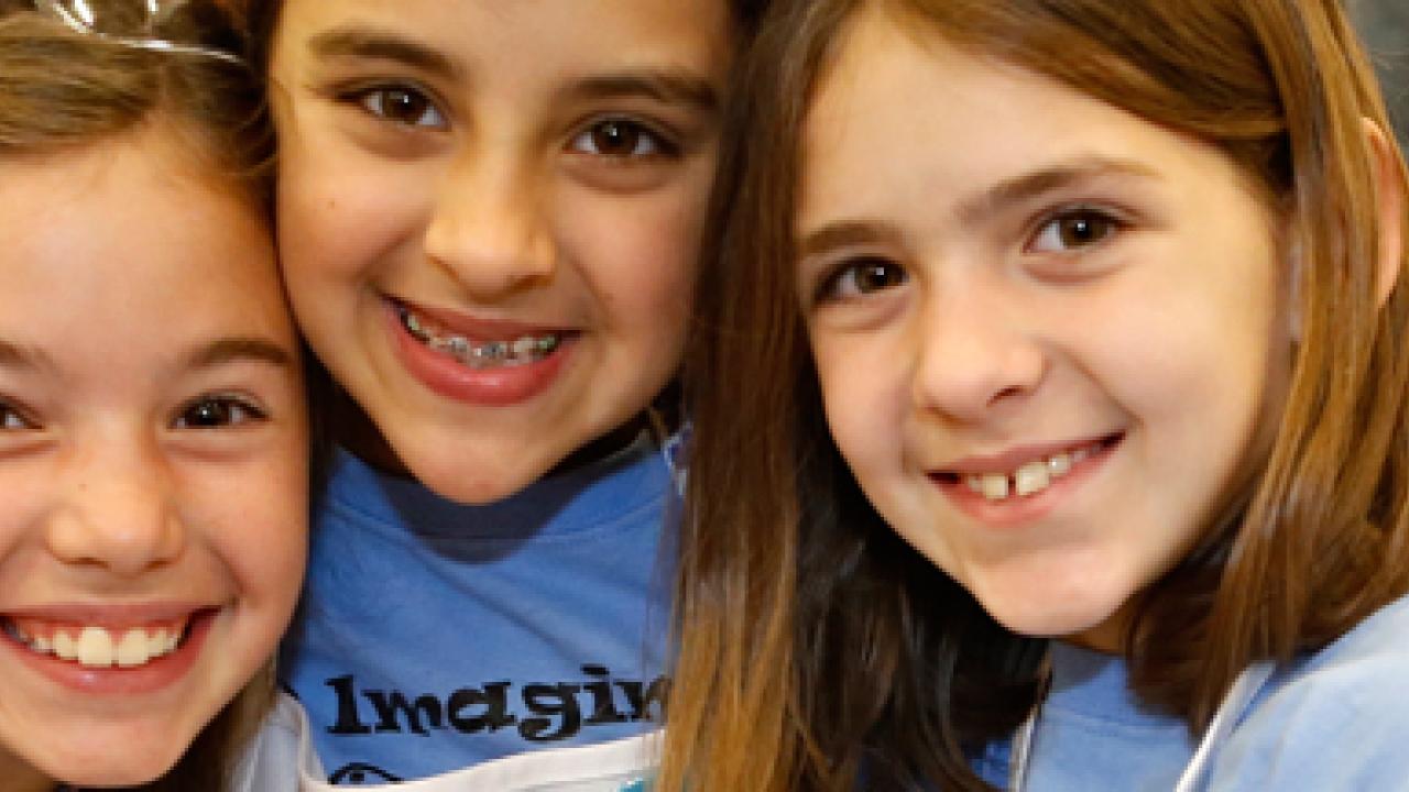 three girls smiling
