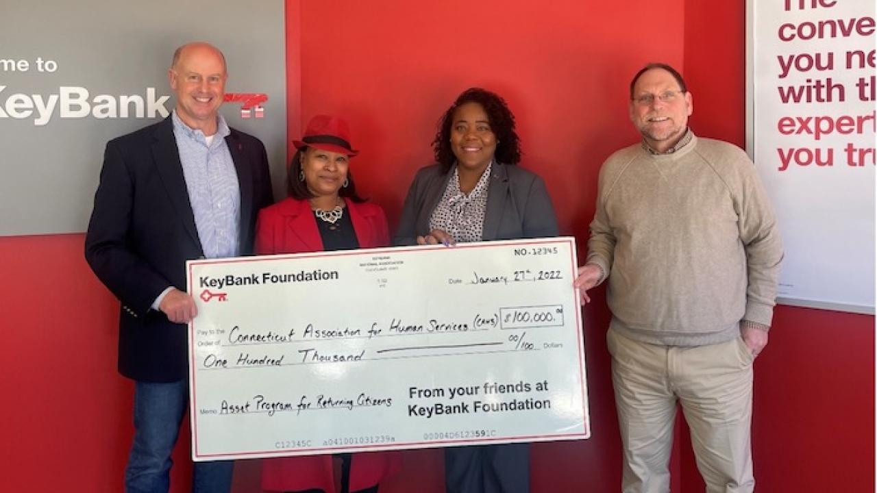 Photo caption: KeyBank’s Market President James Barger (left) and Corporate Responsibility Officer LaKisha Jordan (center right) present a $100,000 grant to CAHS CEO John Merz (right) and Director of Asset Building Programs Takima Robinson (center left).  Photo credit:  KeyBank 