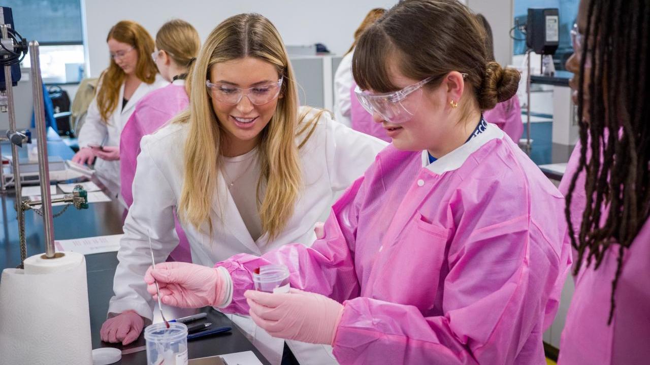 People in a lab making lipgloss