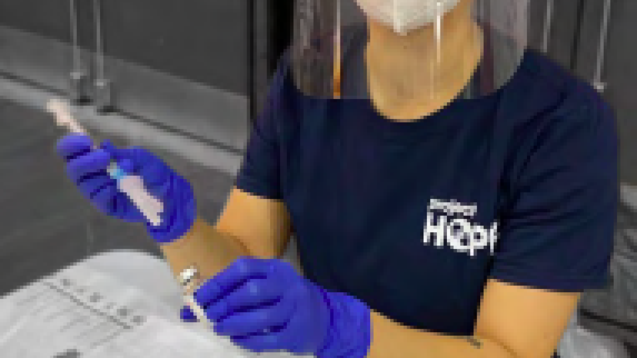person wearing protective equipment in laboratory