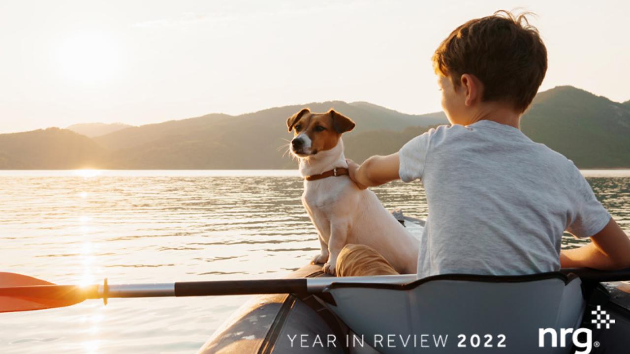 Child with dog in a kayak