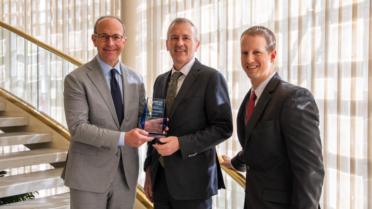 Cintas employees holding award