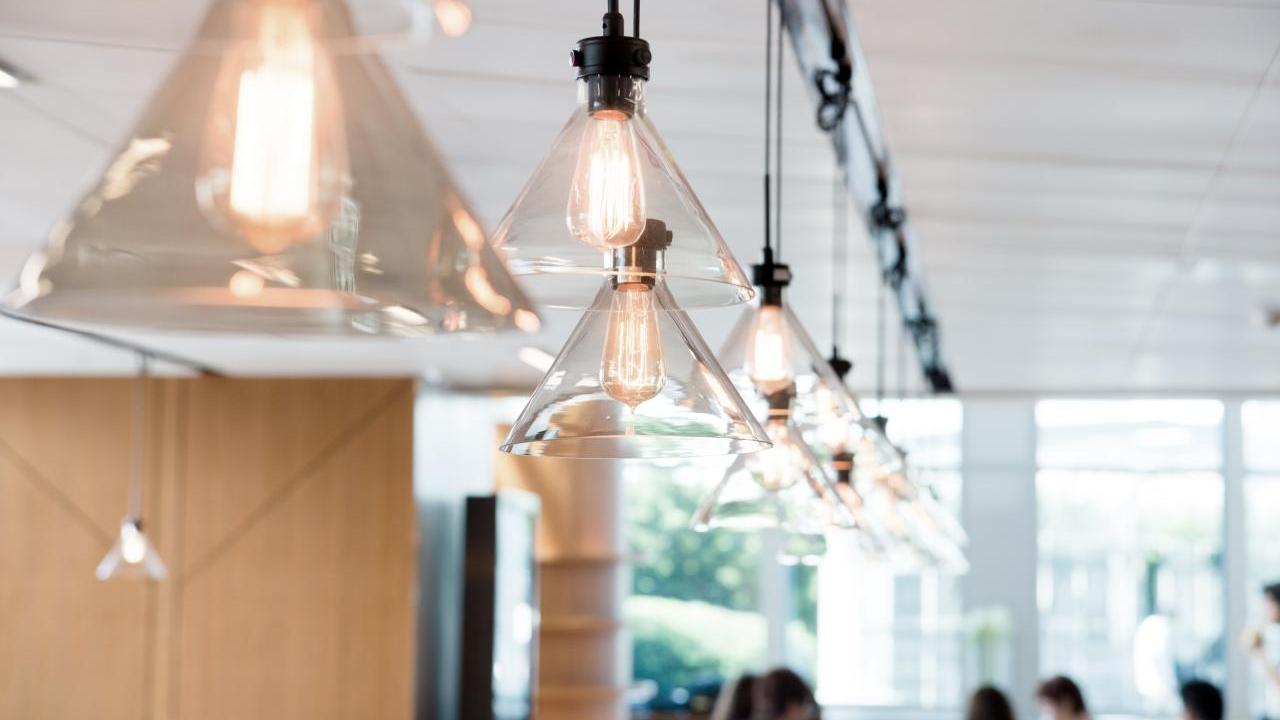 A row of lights hanging from a ceiling