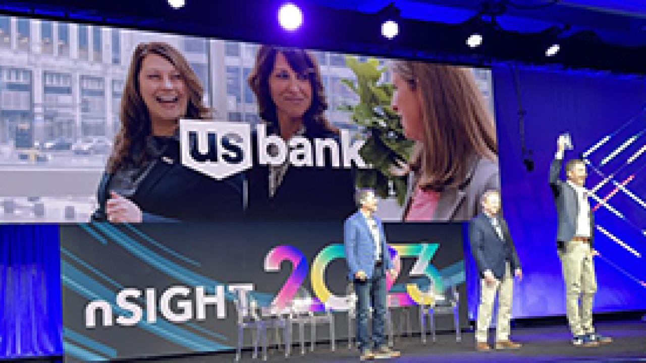 Transformation strategy executive Tina Cartwright and shared services leader Jay Clark accept the Financial Services Impact Award.