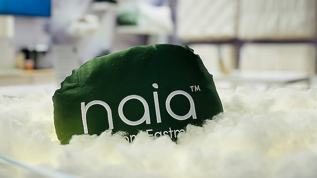 Naia renew staple fiber. Hat shown on top of the fiber.