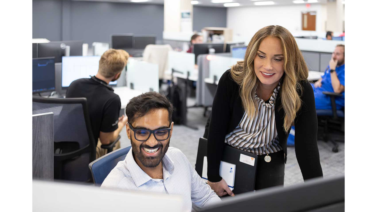 Employees working and smiling