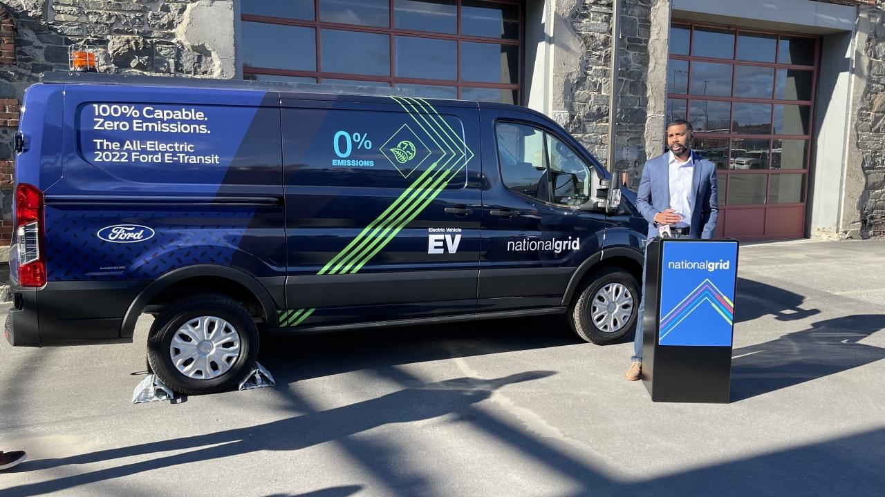 National Grid spokesperson in front of new Ford vehicle