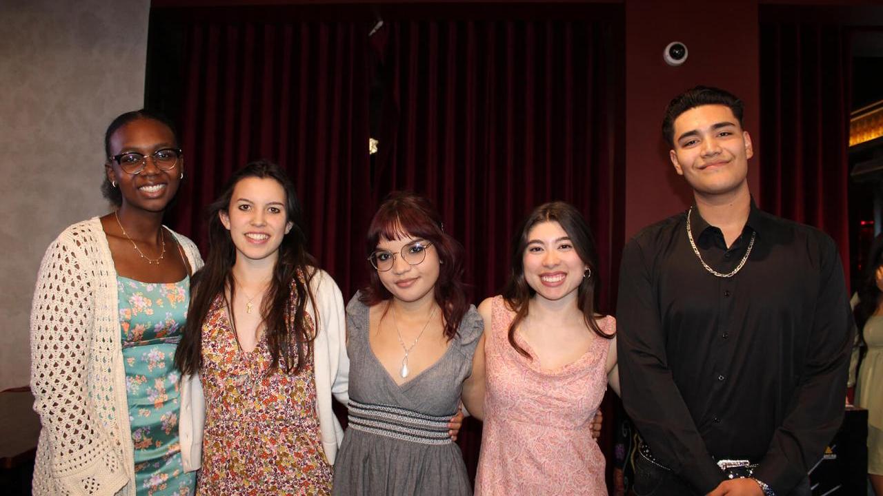 young people in formal wear, smiling