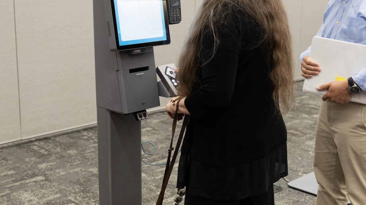 people using self-service kiosk