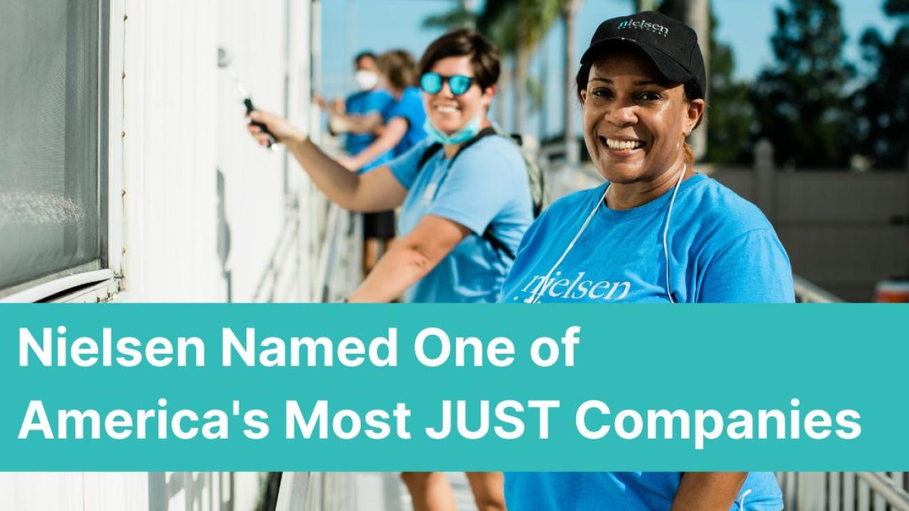 Nielsen Named One of America's Most JUST Companies: Image shows four Nielsen employees wearing Nielsen t-shirts painting a house.