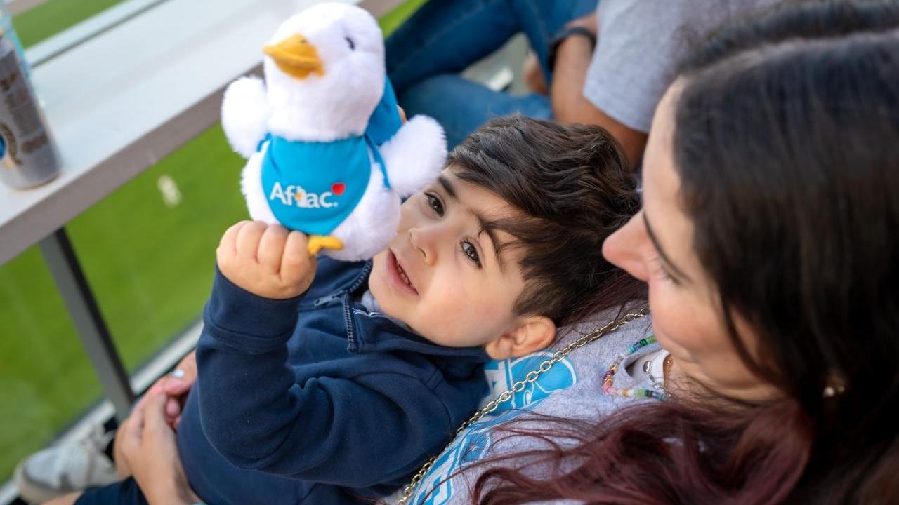A child with an Aflac duck