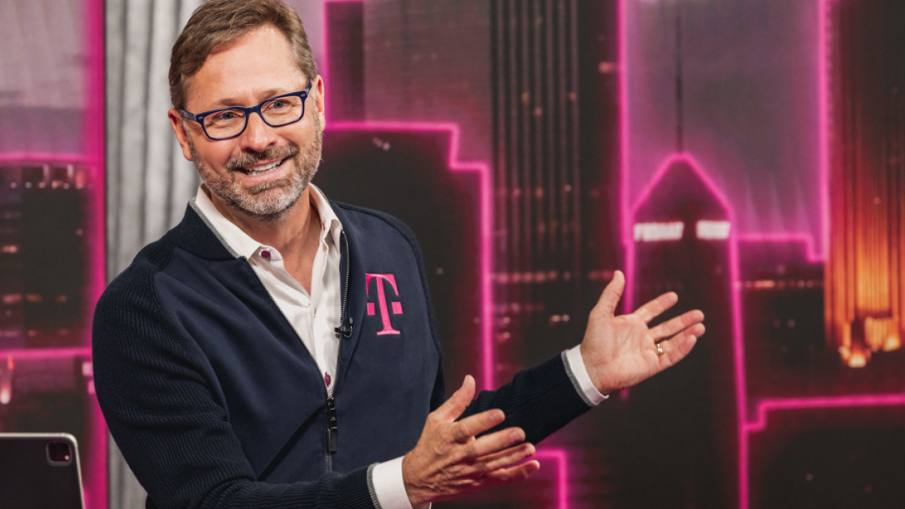 CEO Mike Sievert smiling and gesturing