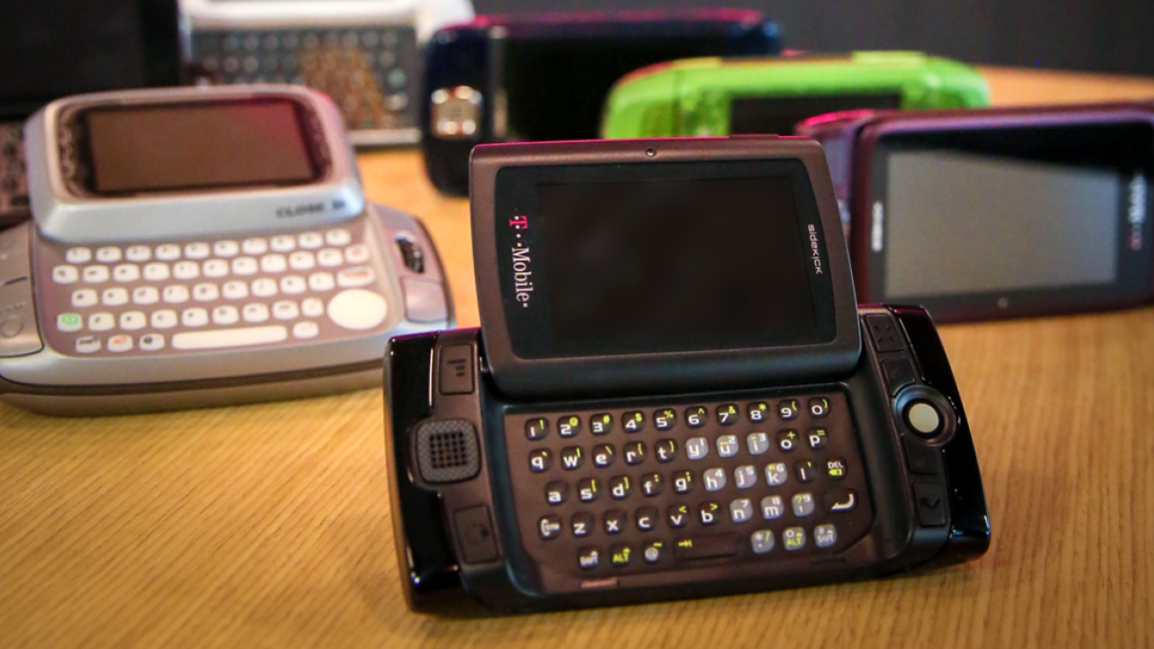 Flip phones arranged on a desk