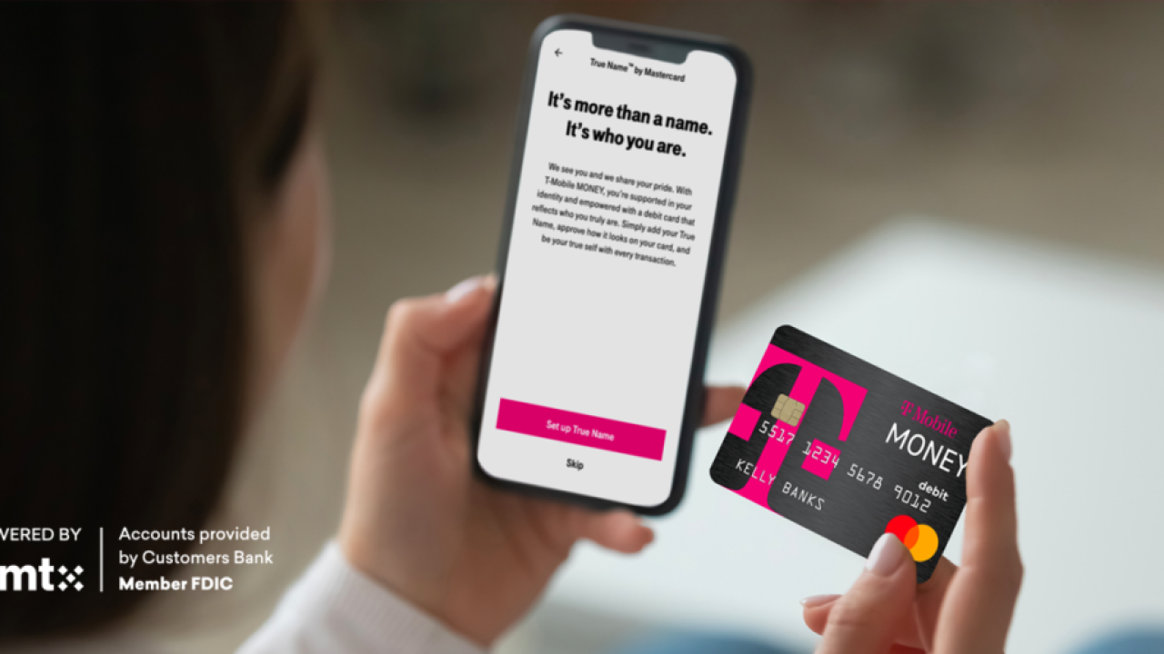 Person holding cell phone and credit card