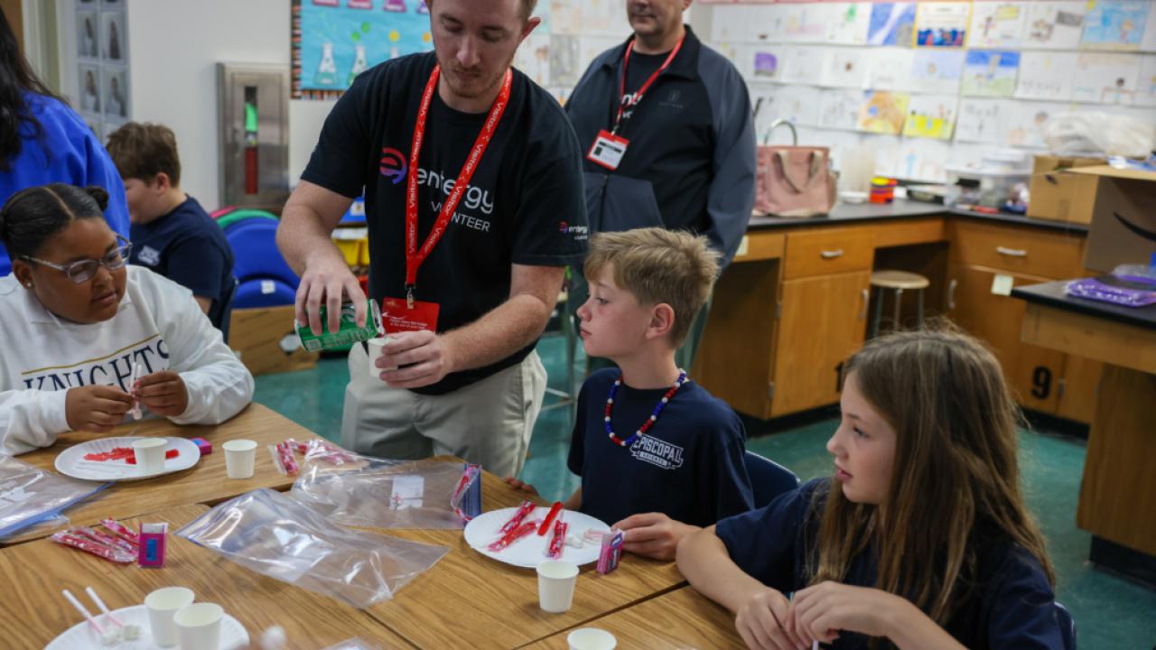 teachers working with students in a classroom