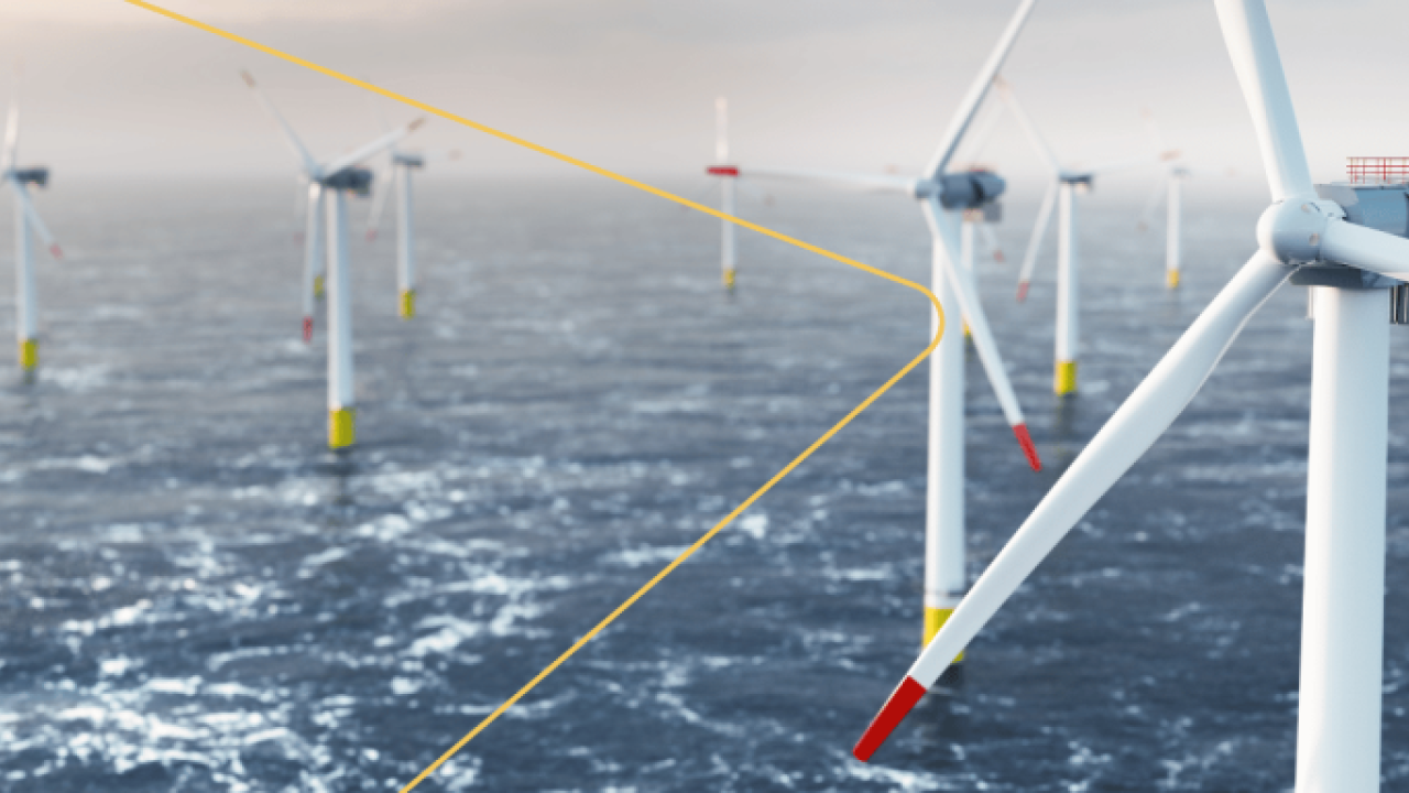 Many wind turbines in a wide expanse of water.