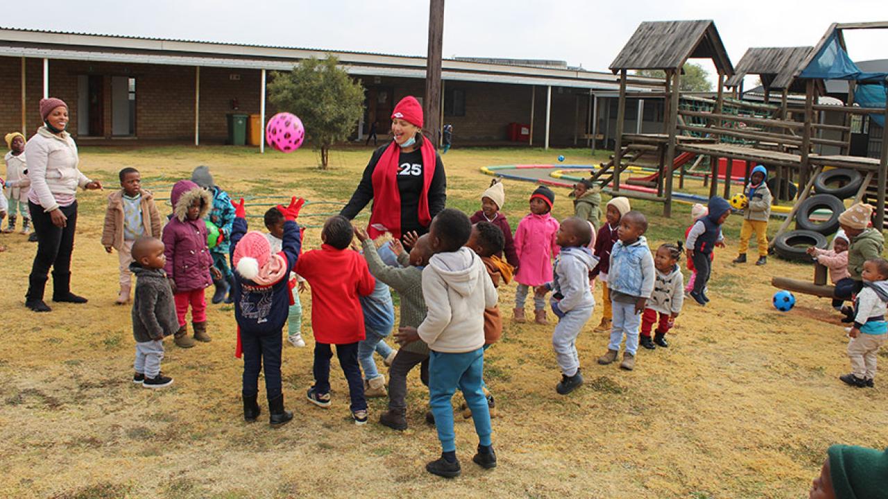 a group of children playing outside in a courtyard