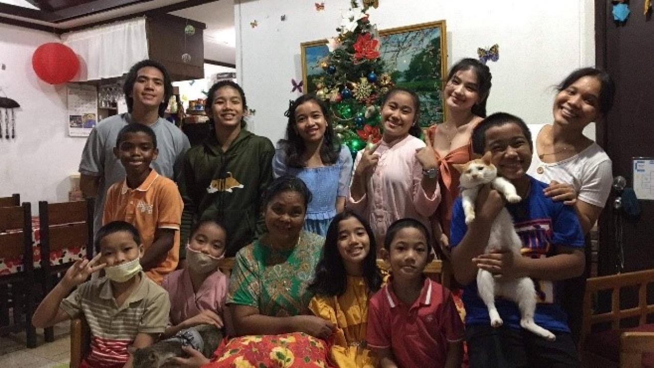Youth and caretakers gather at the House of Love.