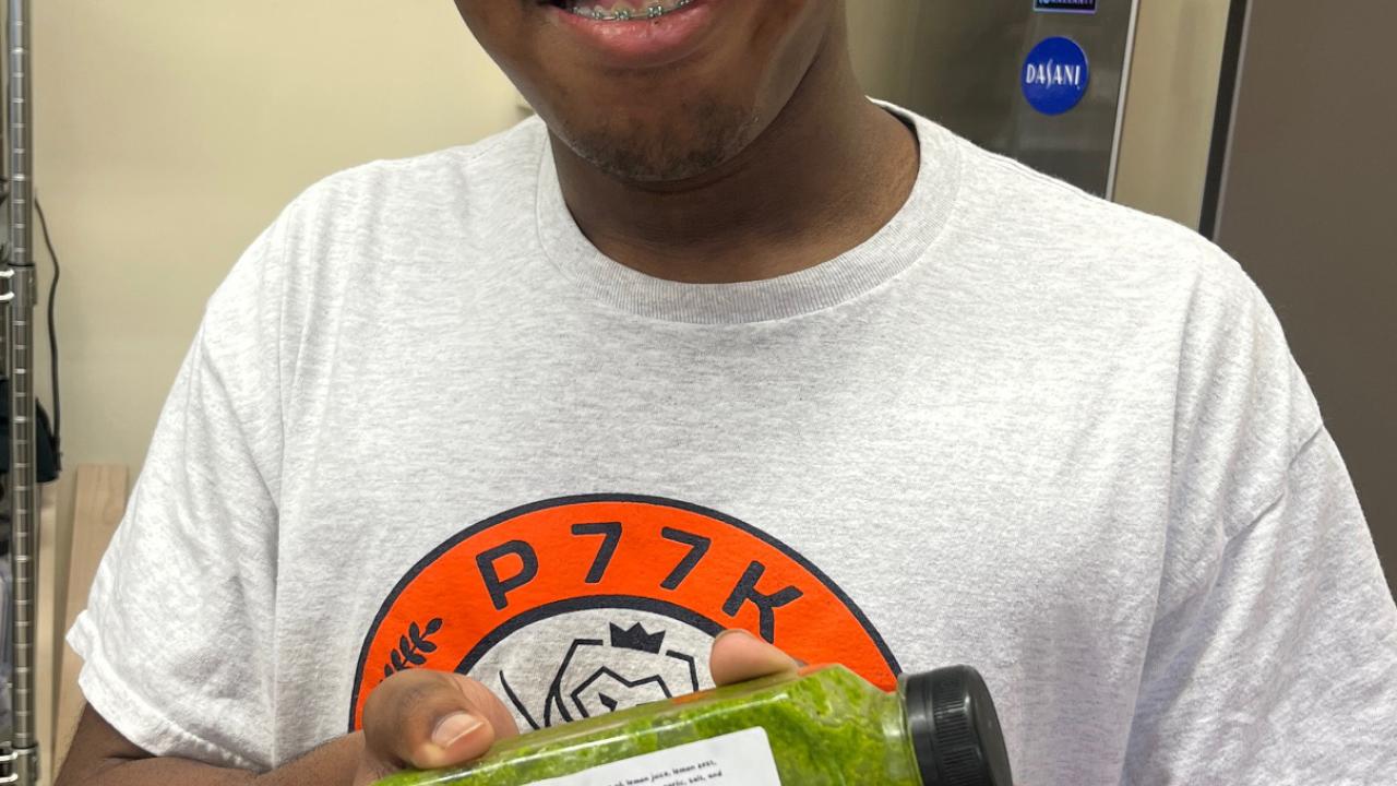 person holding up a juice