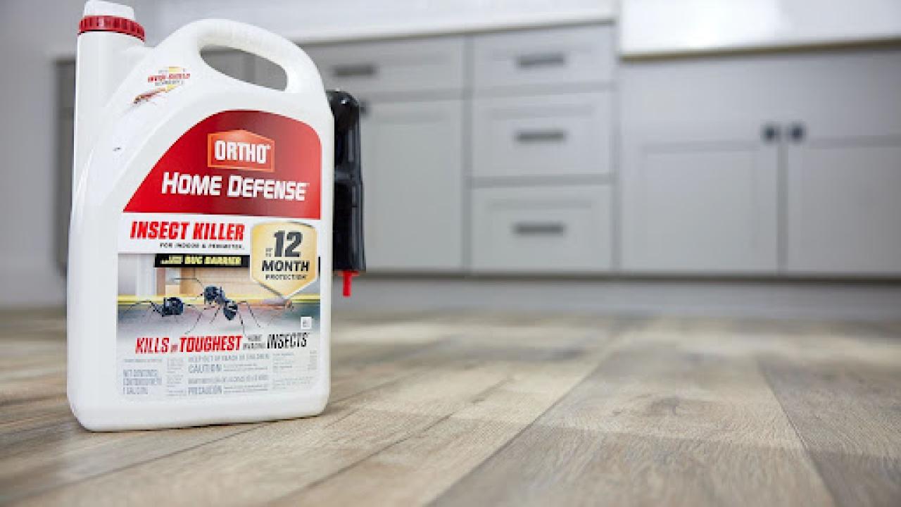 example of new packaging showing container of Home Defense on the floor of a kitchen