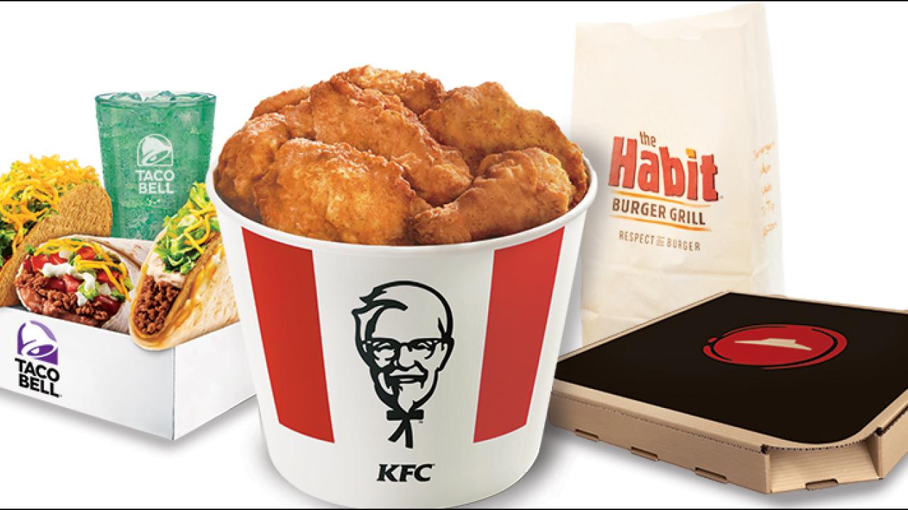 Four different take out containers from different restaurants.