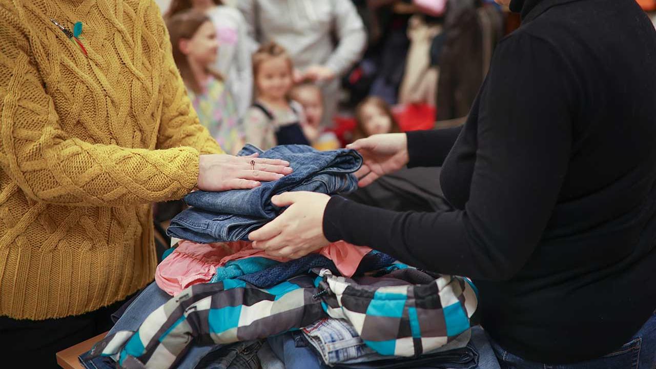 People handling clothing