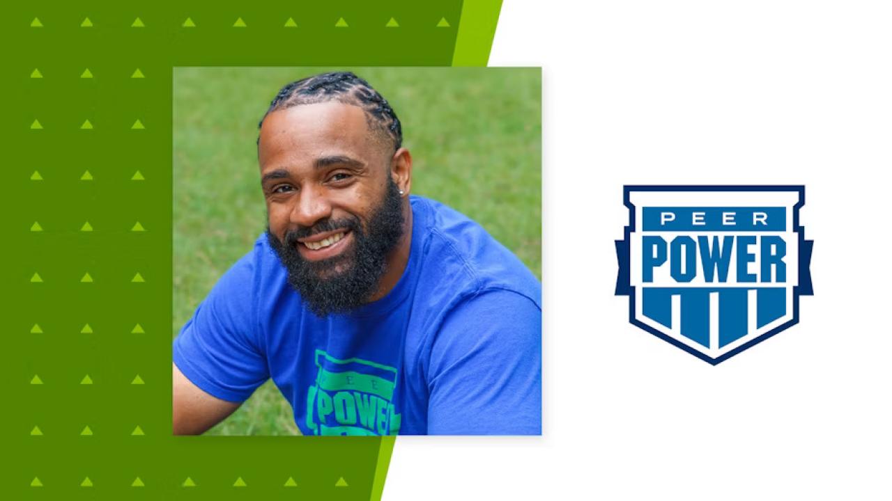Marlon Ross Jr. central, sitting on grass. Peer Power logo to the right.