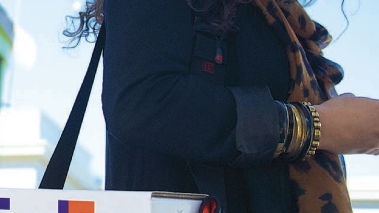 person with a FedEx box in a bag