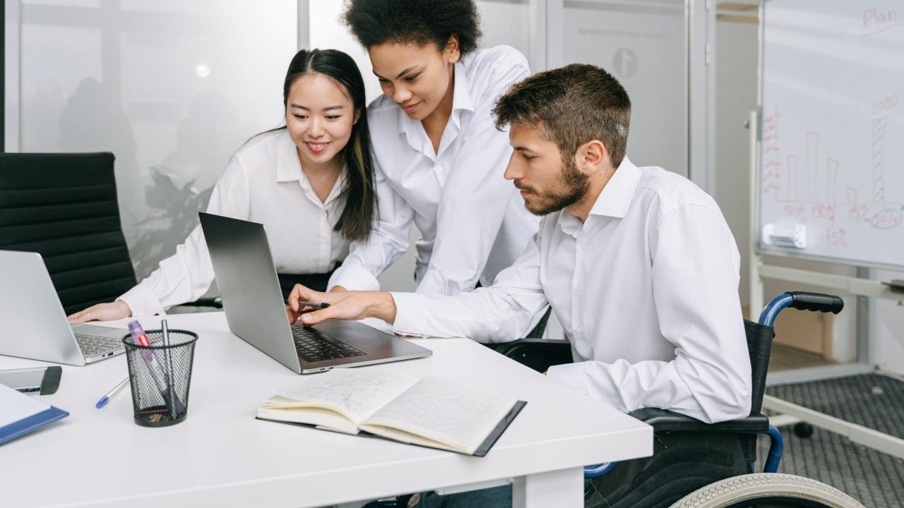 coworkers at a computer