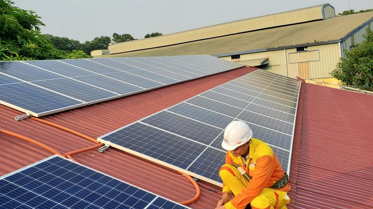 Man working on solar panels
