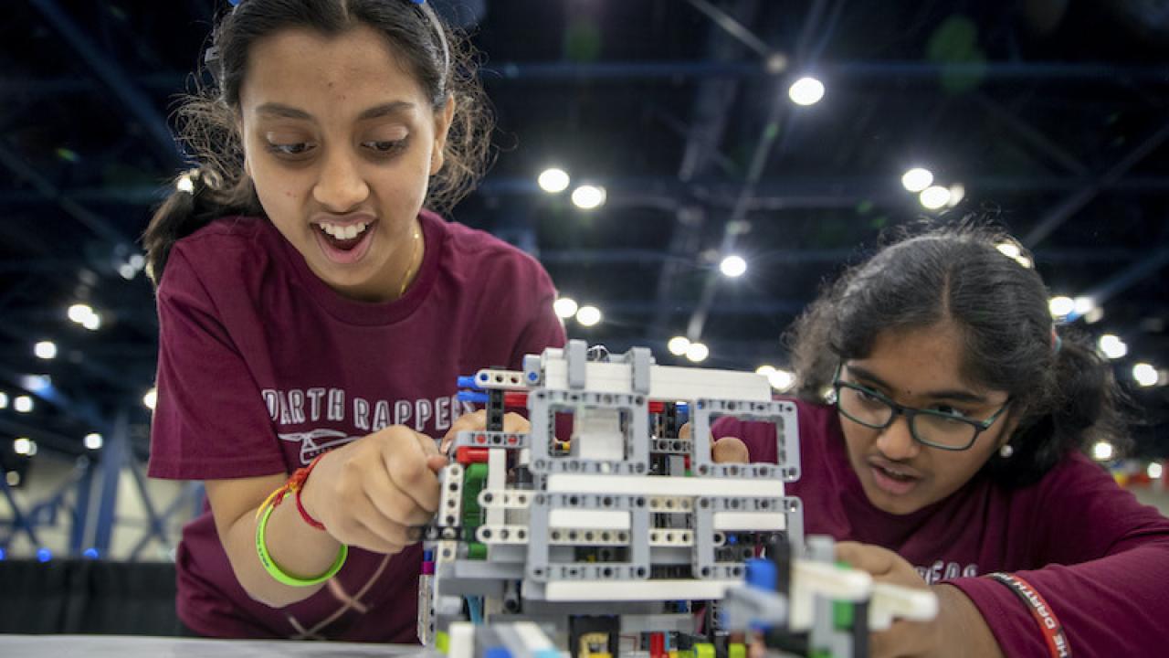 2 students work on a STEM project