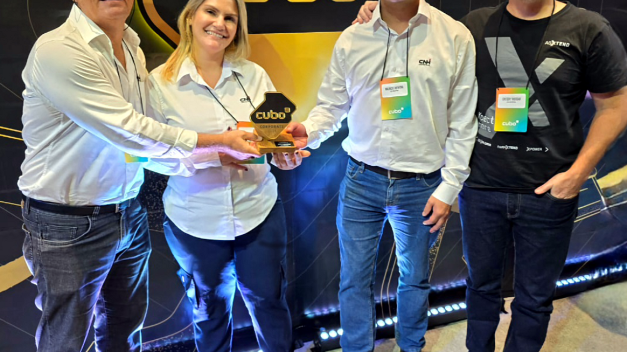Four people holding the Golden Cube award