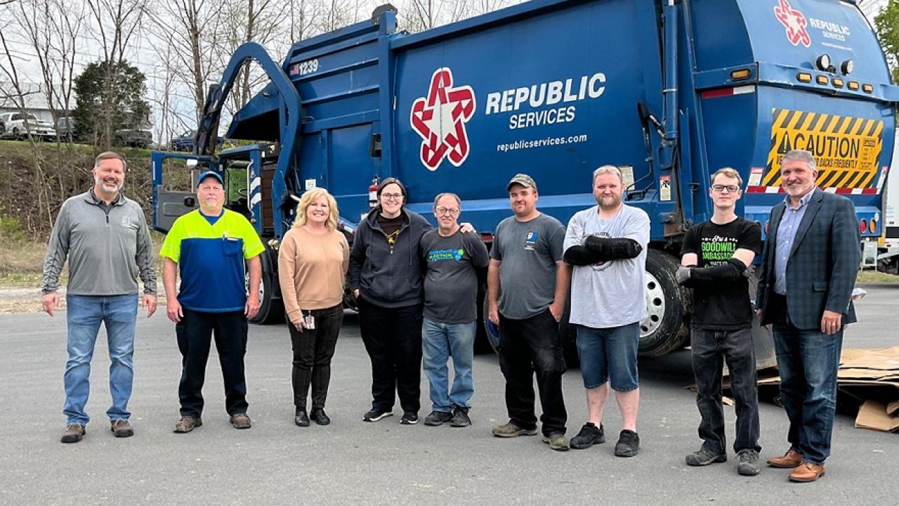 people in front of a republic services truck