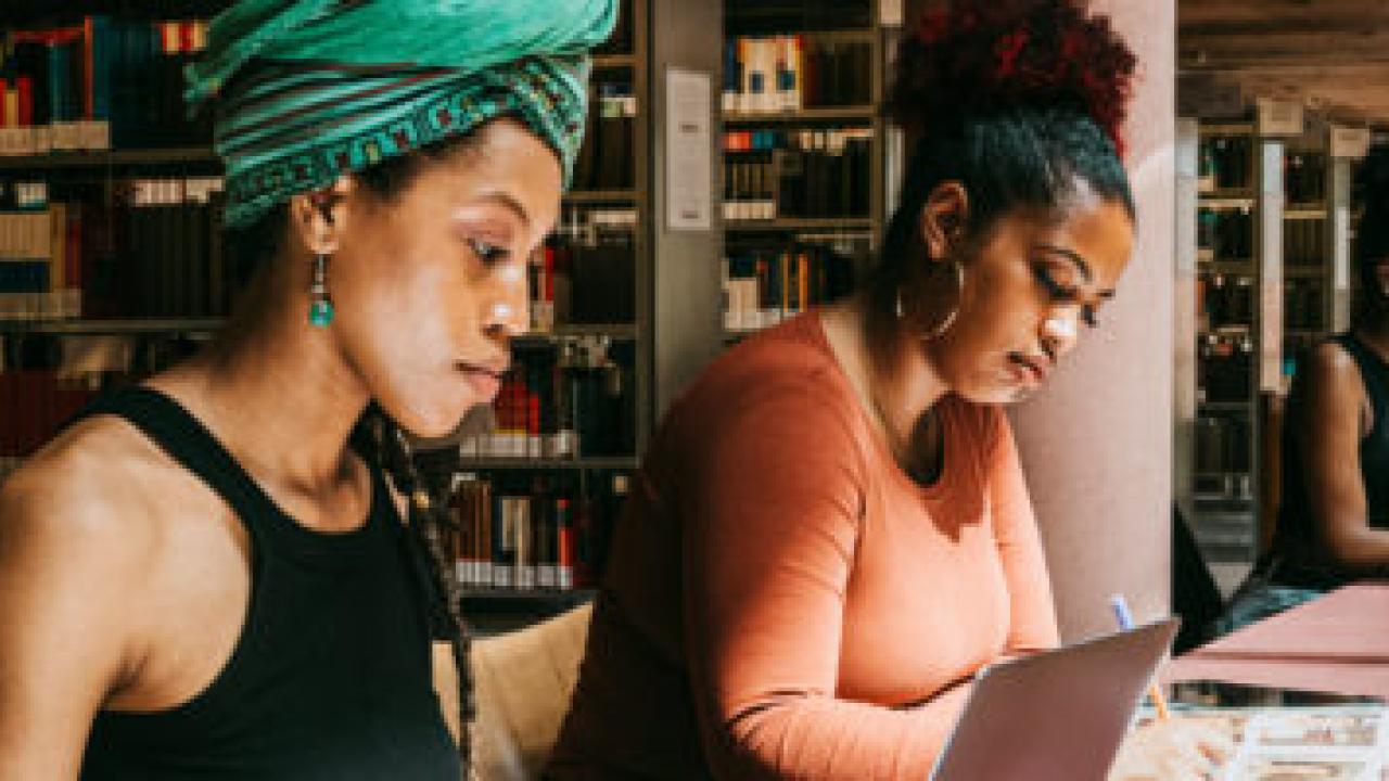 People studying in a library