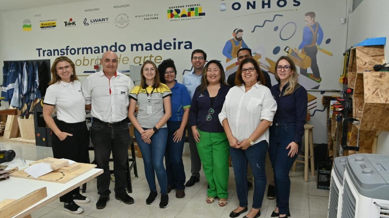 A group of people posed in a workshop
