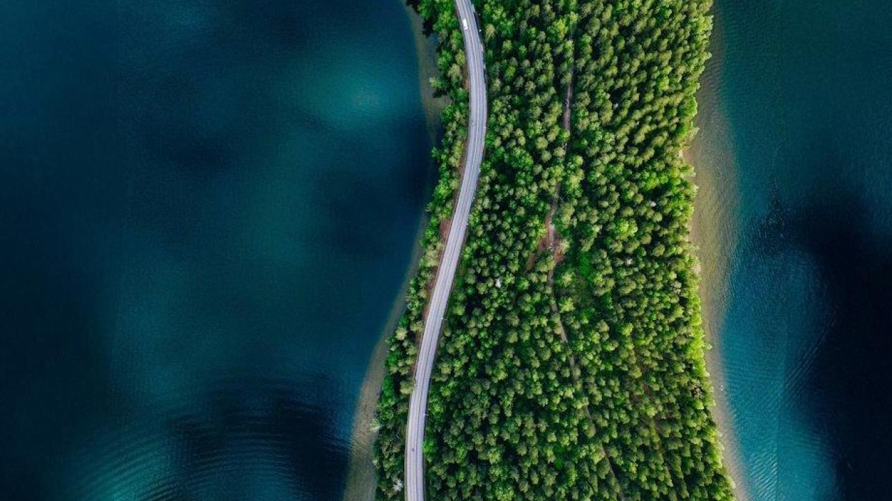 road on land in between water