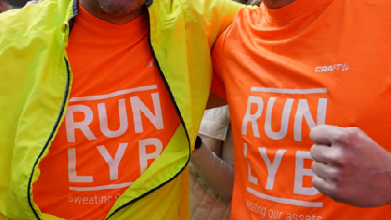 Two runners in matching shirts.