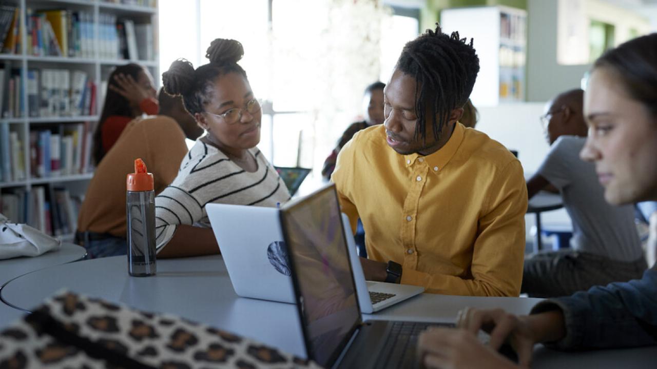black students working on laptops