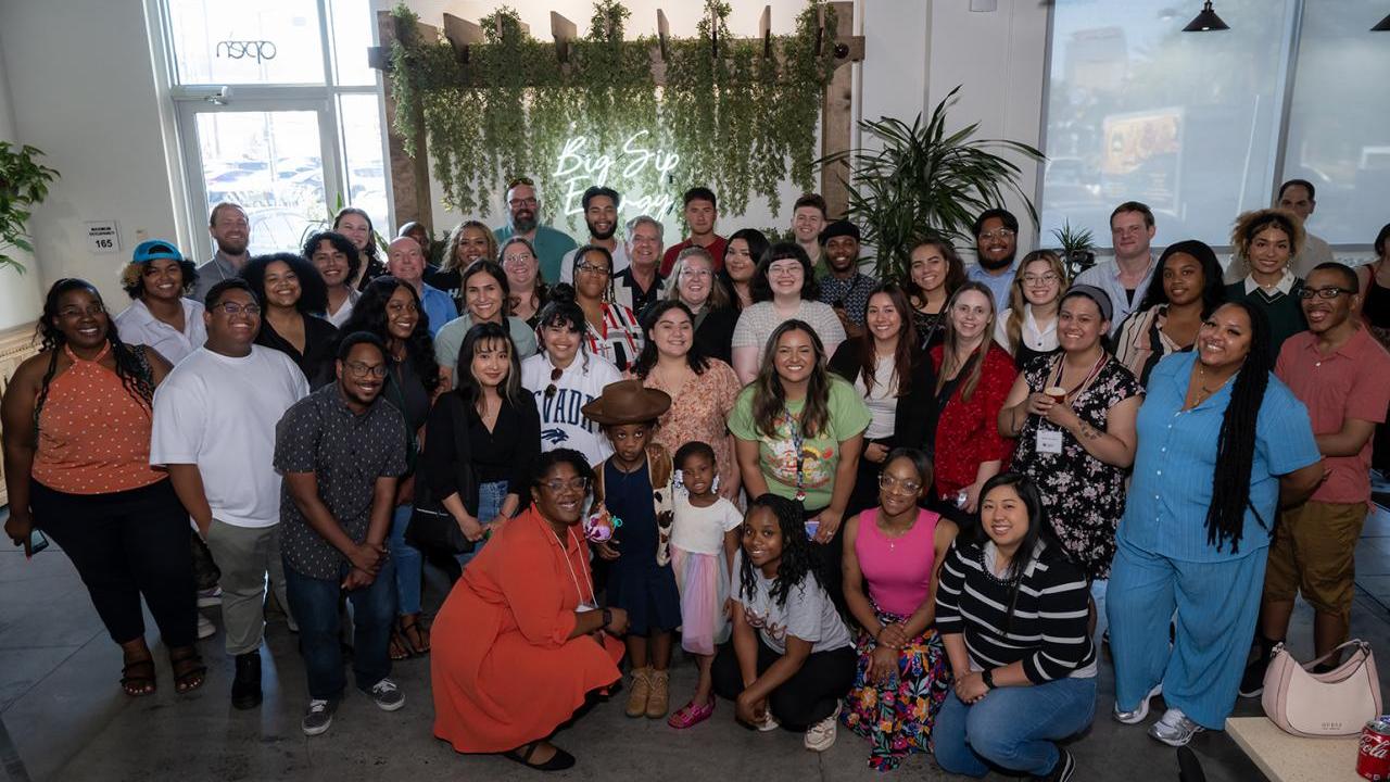A large group of people smiling for the camera