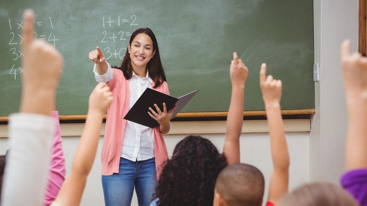 teacher in front of classroom
