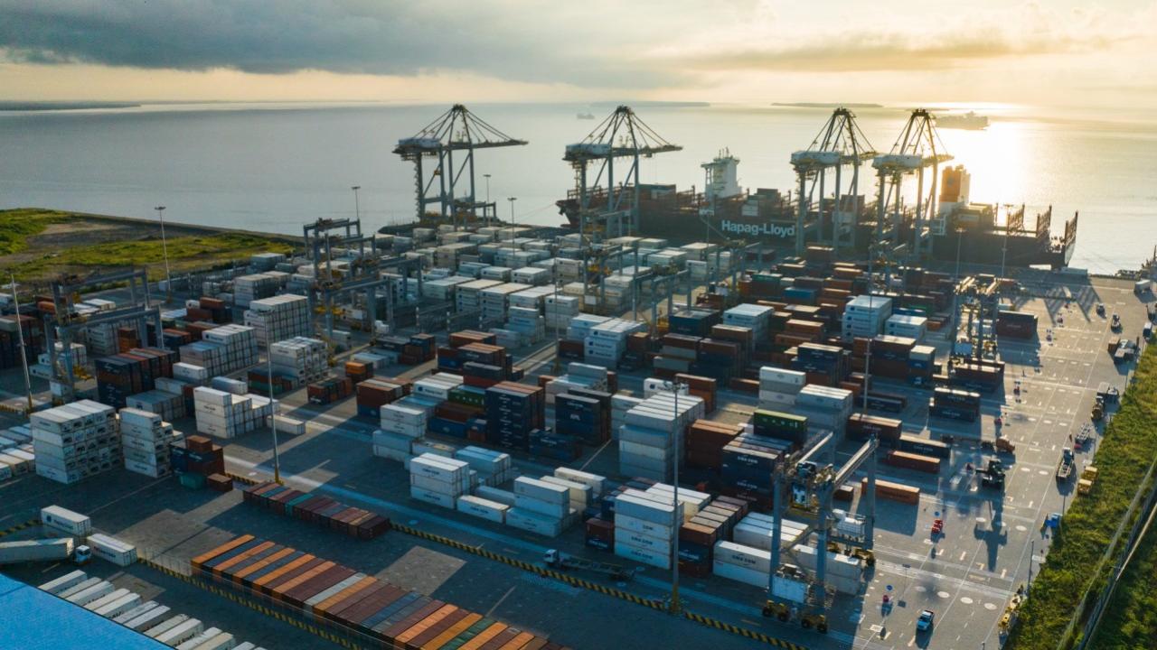 Aerial view of containers at a port by the ocean