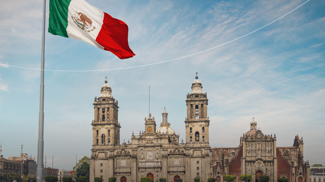 A flag flying in front of a building