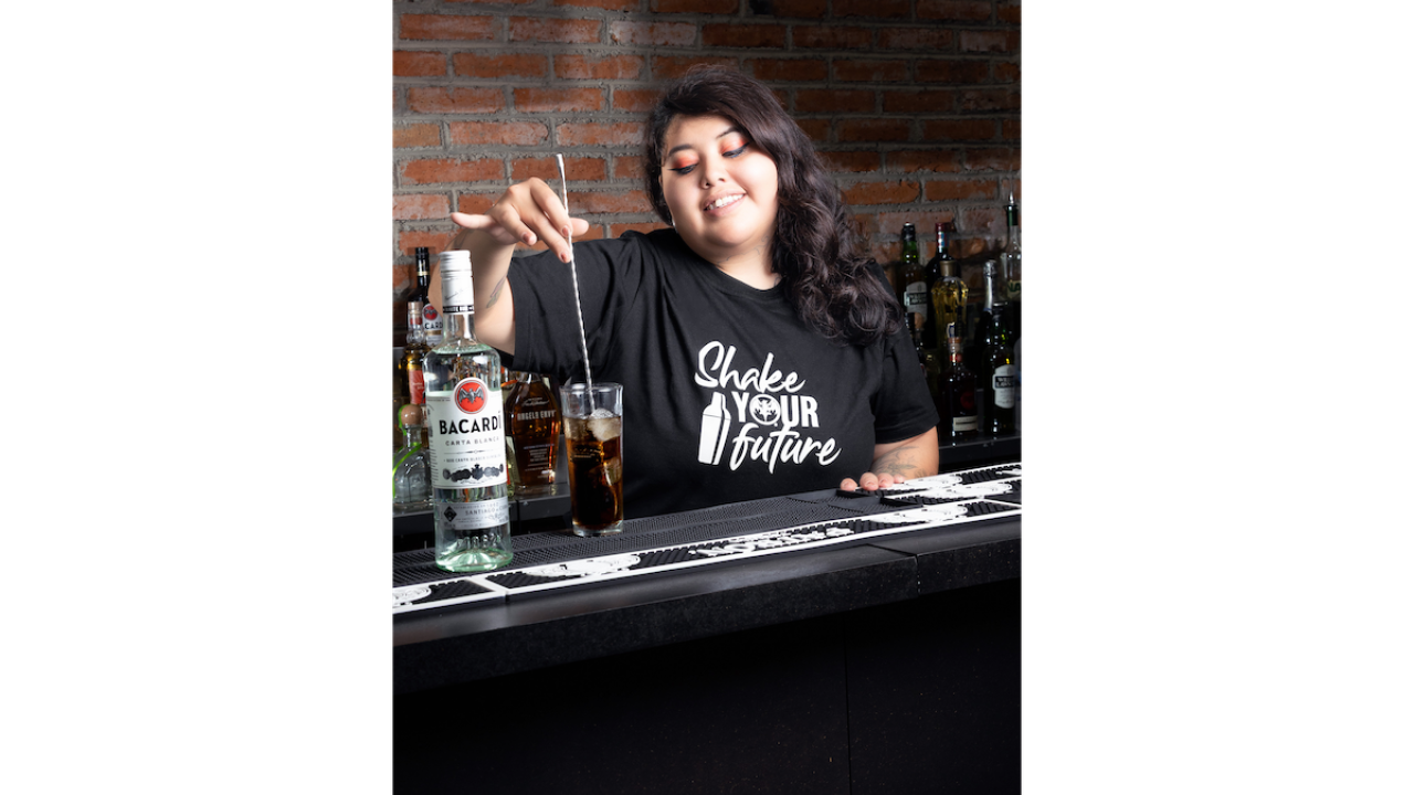 person mixing a drink