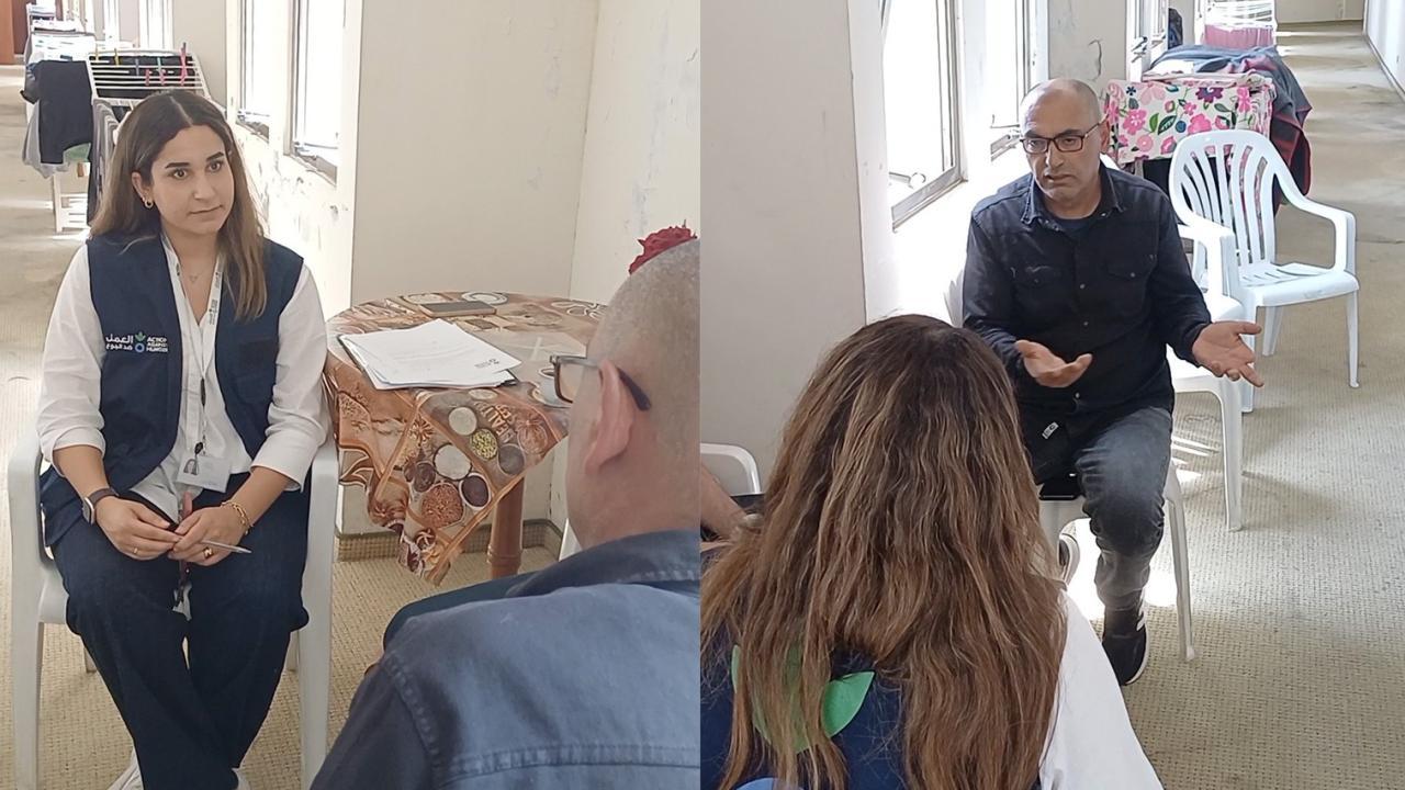 Mahmoud tells an Action Against Hunger staff member about his experience. 